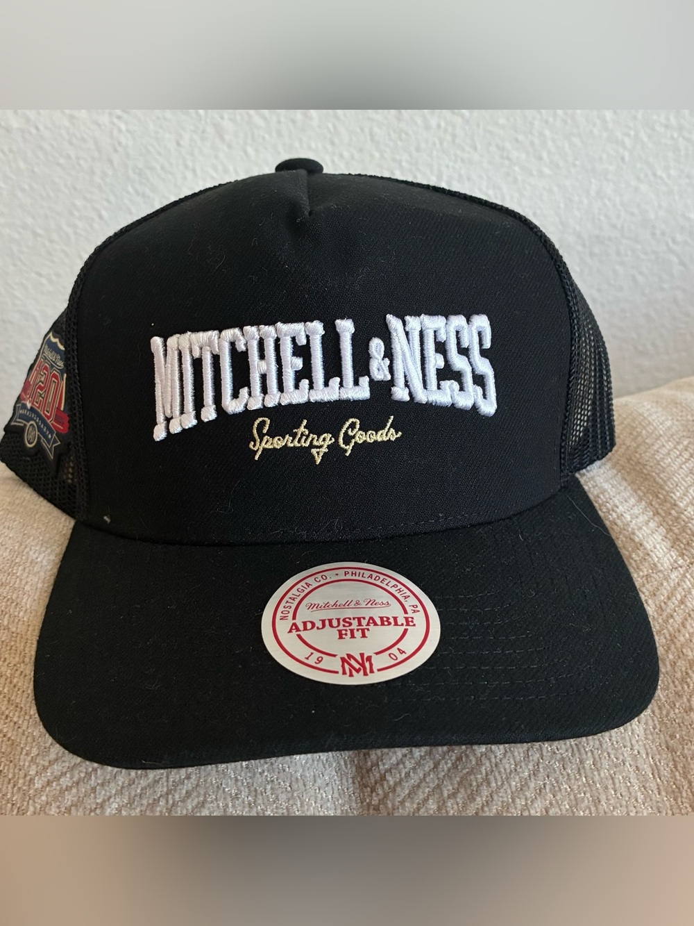Mitchell & Ness Black Trucker Hat with White & Gold Embroidery